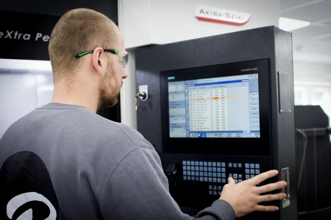 machinist working on dugard machine